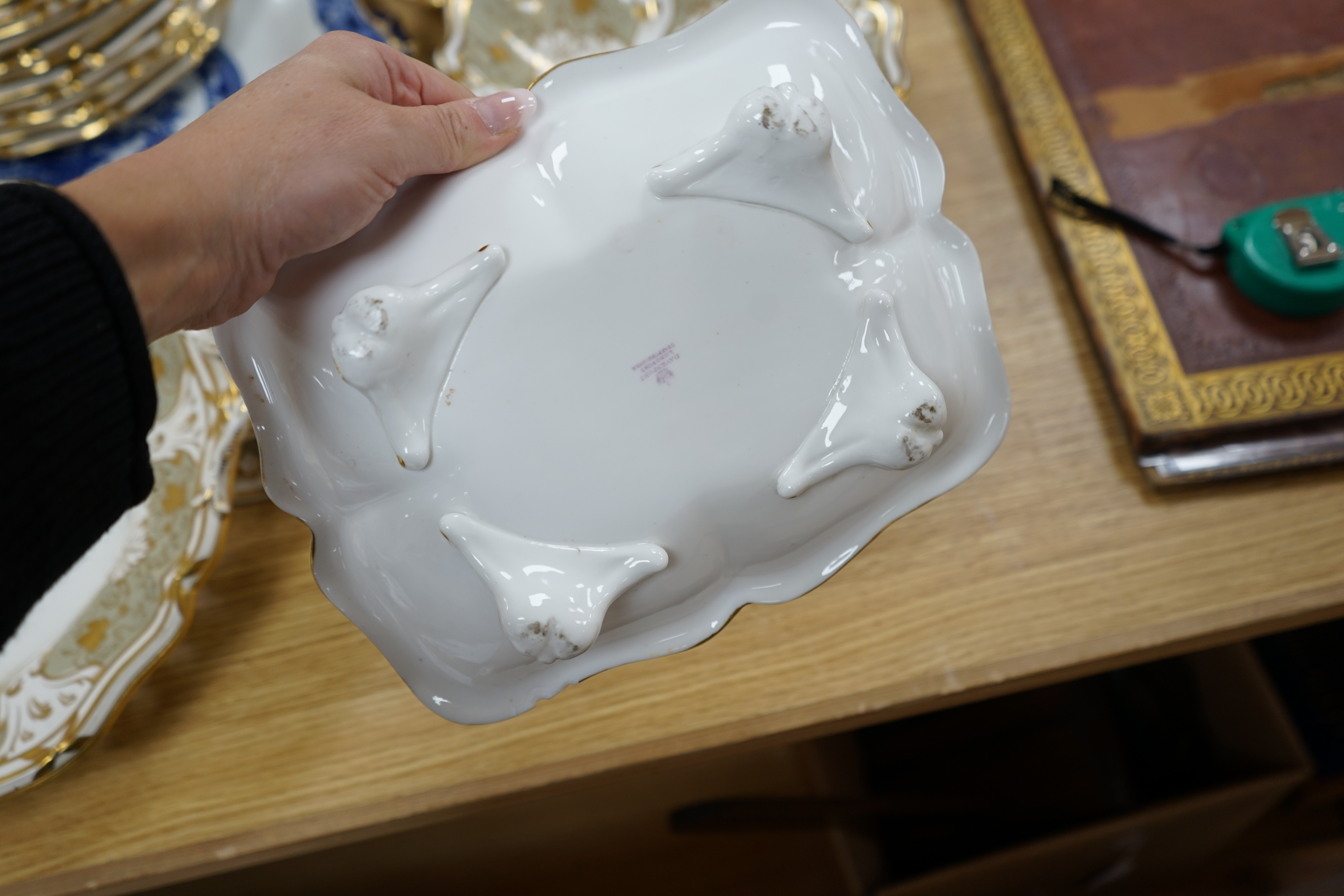 A Davenport part grey and gilt dessert service, together with a blue and white circular serving dish, dish 43cm wide. Condition - comport base broken